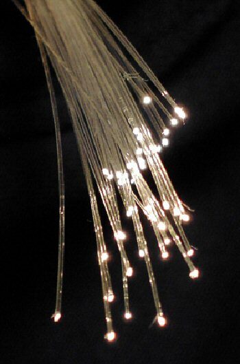 Illuminated fibre optic strands glowing in the dark