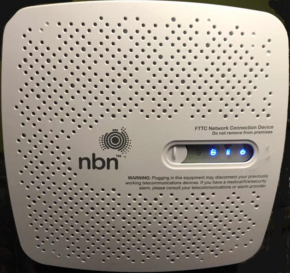 An nbn FTTC connection device, a small white box labelled FTTC Network Connection Device