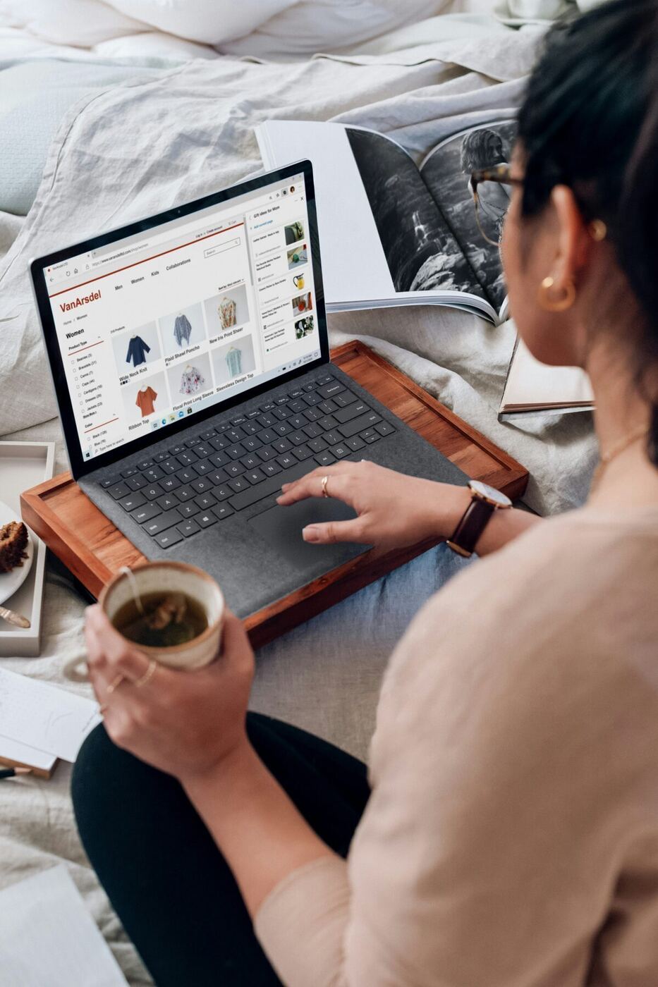 A person in professional attire comparing options on a laptop