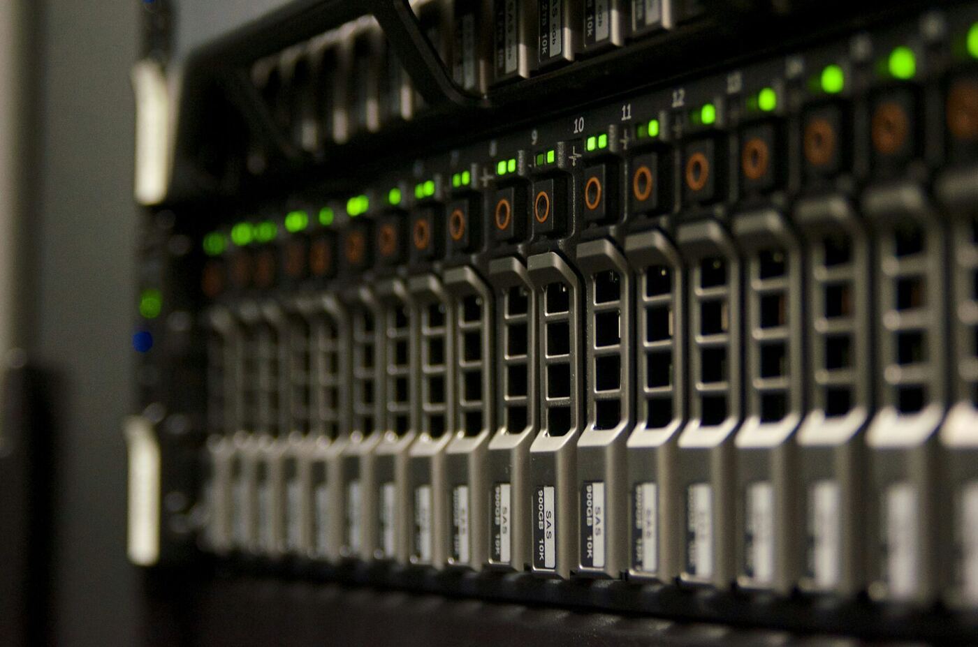 A server rack with blinking green status lights in a data centre